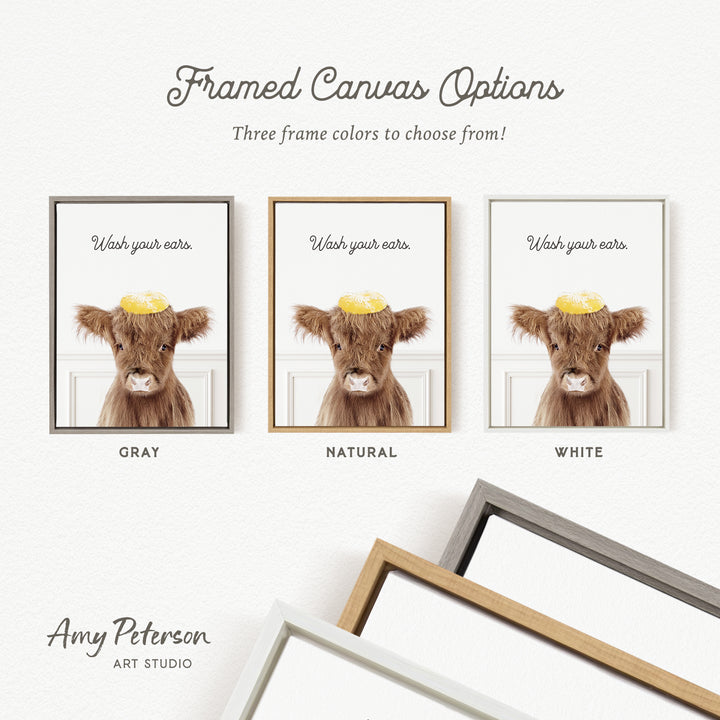 three framed canvas options featuring a cow with a yellow hat on its head, each with a different frame color: gray, natural, and white.