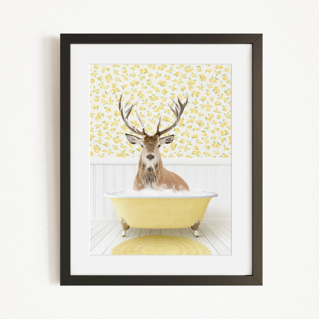 A deer with antlers is sitting in a yellow bathtub filled with bubbles, against a yellow and white floral wallpaper background.