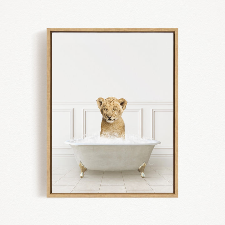 A young lion cub sitting in a white bathtub filled with water, looking at the camera with its eyes closed.