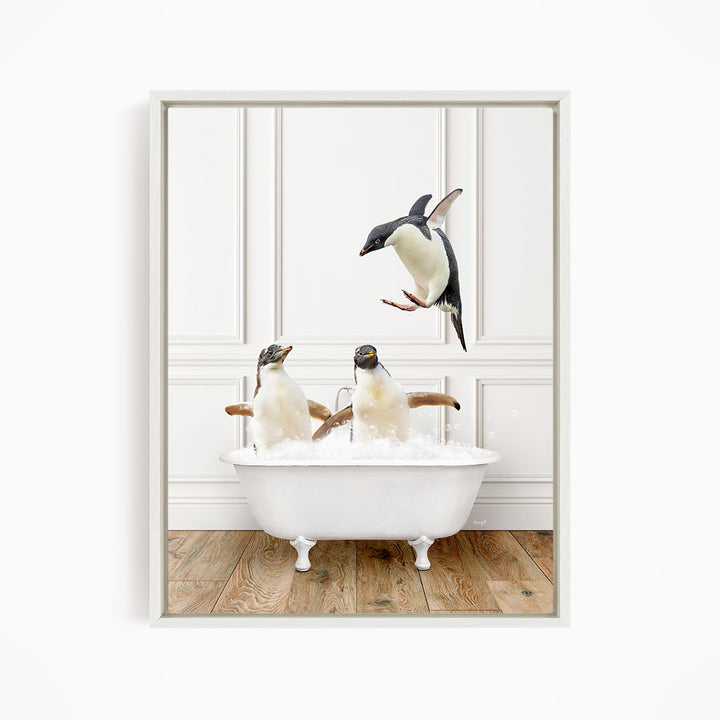 A framed image depicting two penguins sitting in a bathtub, with one penguin flying towards the other penguin.