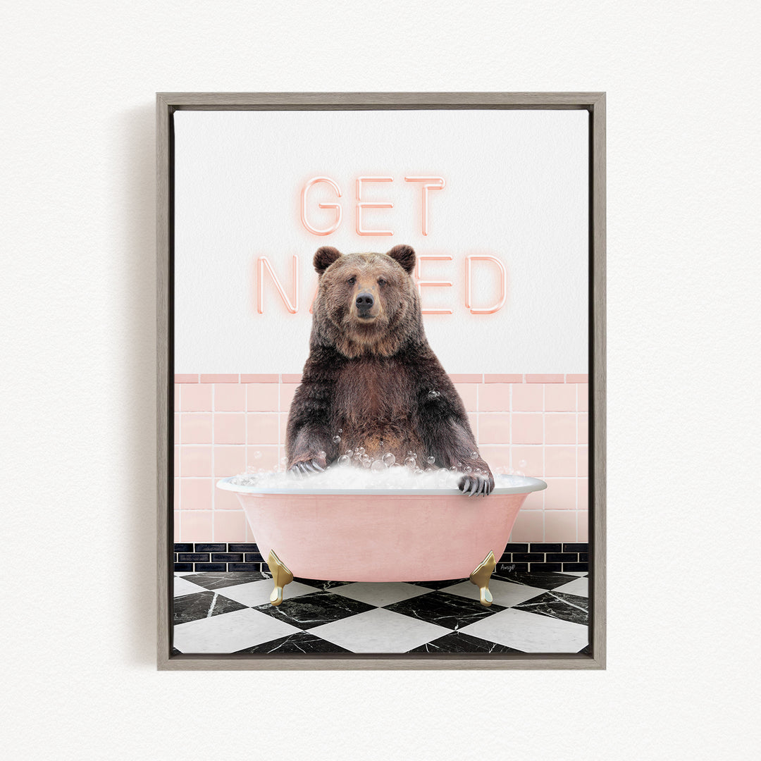 A brown bear sitting in a pink bathtub with the words "GET NICKED" written on the wall behind it.