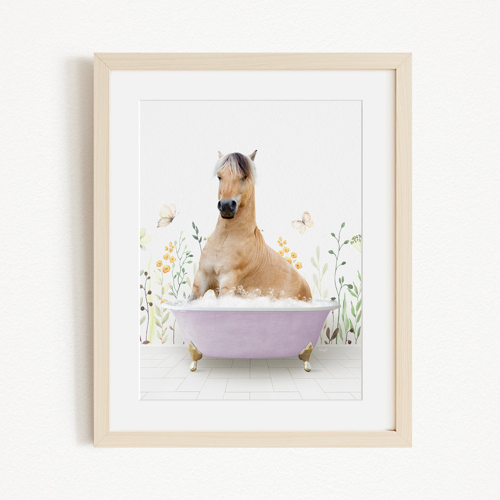 A light brown horse is sitting in a purple bathtub filled with bubbles, surrounded by flowers and butterflies.
