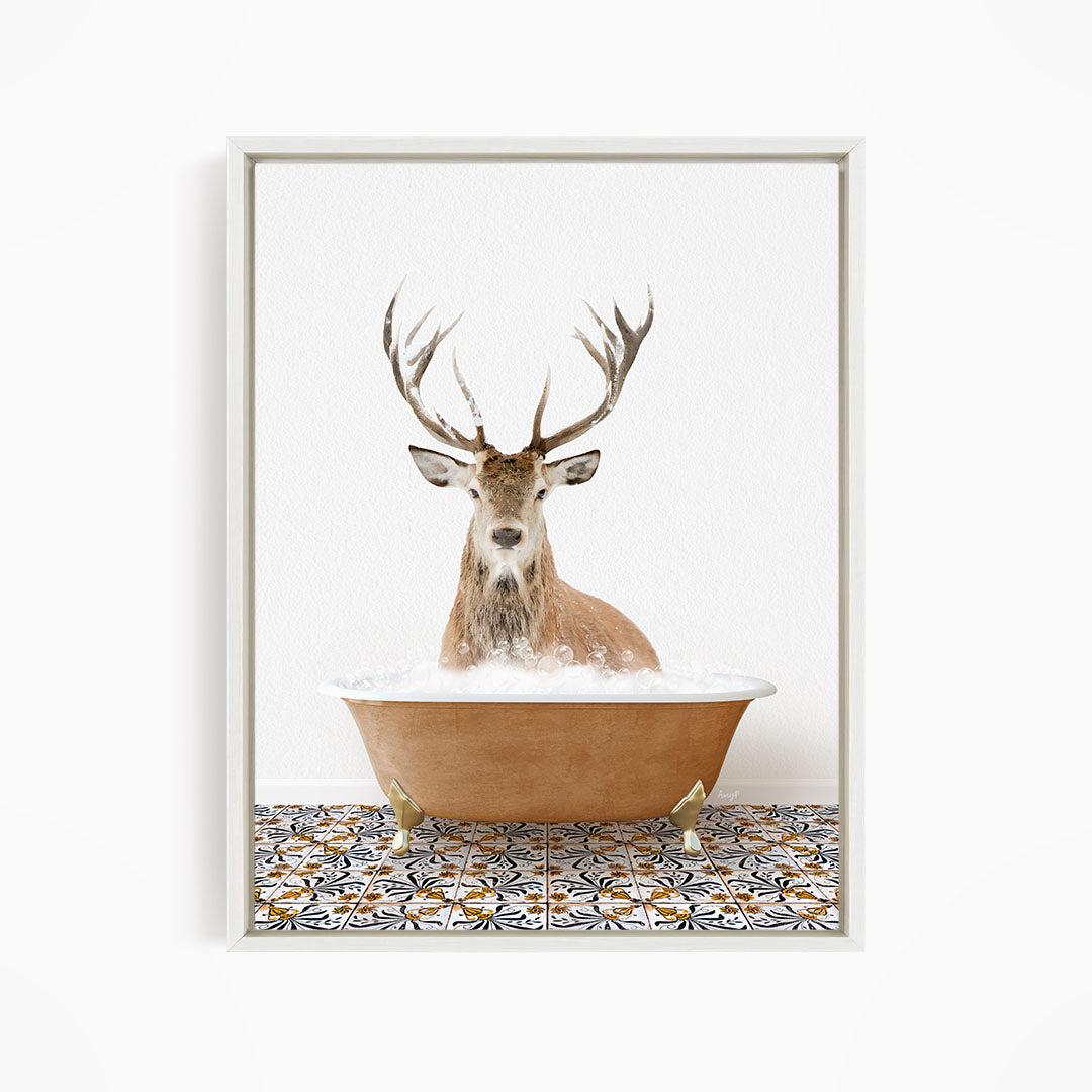 A deer with large antlers is sitting in a bathtub filled with water, creating a whimsical and unexpected scene.