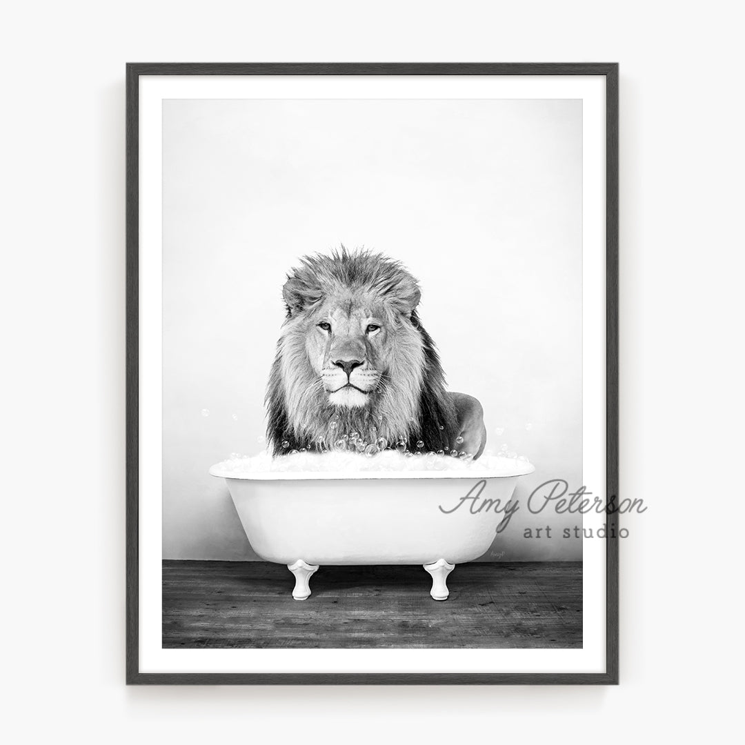 a black and white photo of a lion in a bathtub