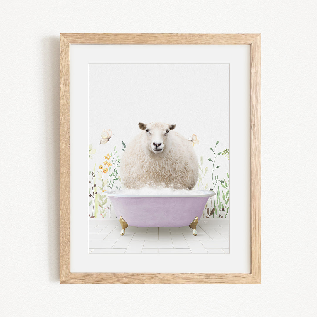 A fluffy white sheep sits in a purple bathtub, surrounded by flowers and butterflies, in a framed artwork.