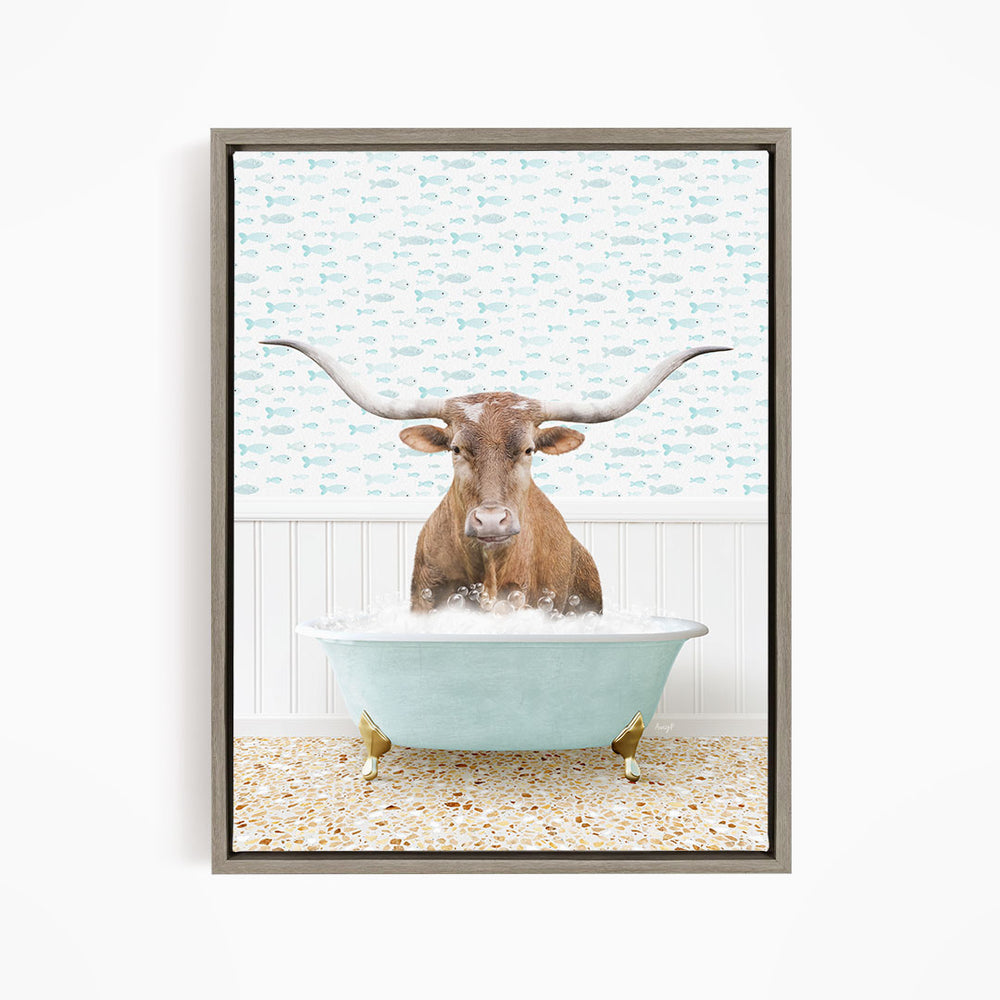 A brown steer with large horns is sitting in a light blue bathtub filled with water, surrounded by a pattern of small fish.