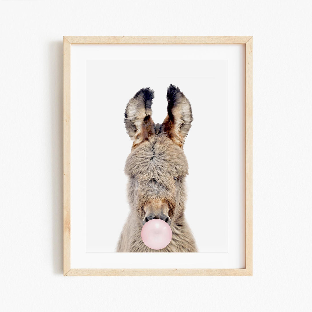 a picture of a dog with a bubble in its mouth