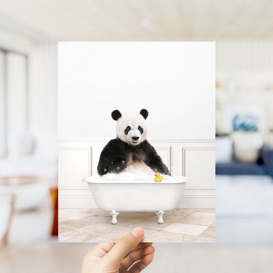 A panda bear sitting in a bathtub filled with bubbles, surrounded by a yellow rubber duck.