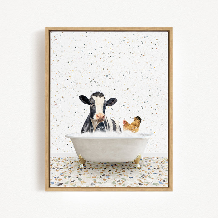A black and white cow is sitting in a white bathtub, surrounded by a chicken and a duck, creating a whimsical and playful scene.