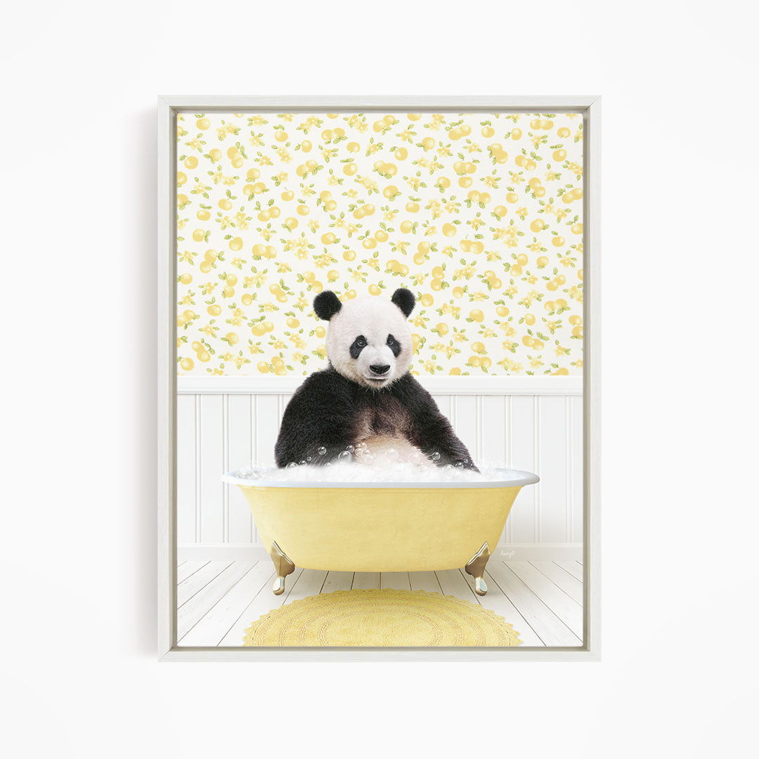 A panda bear sitting in a yellow bathtub filled with bubbles, surrounded by a yellow floral wallpaper.