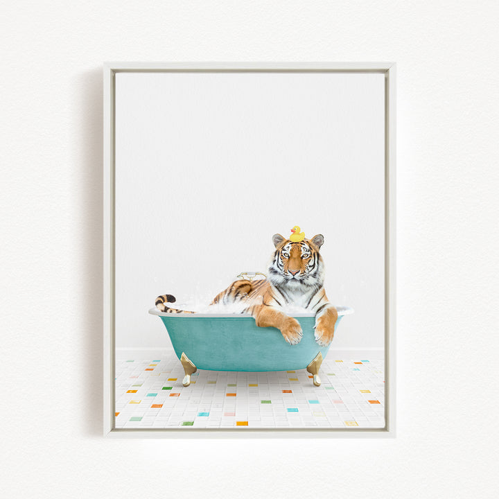 A tiger is sitting in a blue bathtub, wearing a yellow crown, and looking directly at the camera.