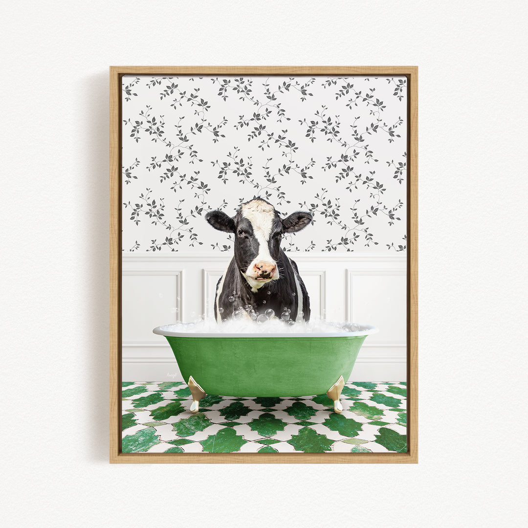 A black and white cow is sitting in a green bathtub filled with water, surrounded by a patterned green and white floor.