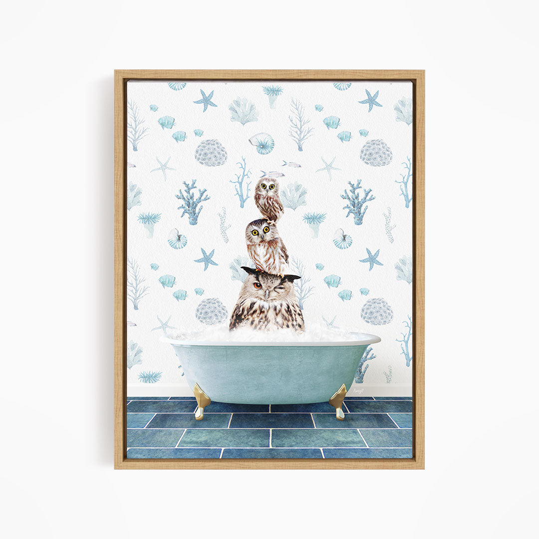 A framed print depicting a brown owl sitting in a blue bathtub filled with water, surrounded by various marine life and starfish.