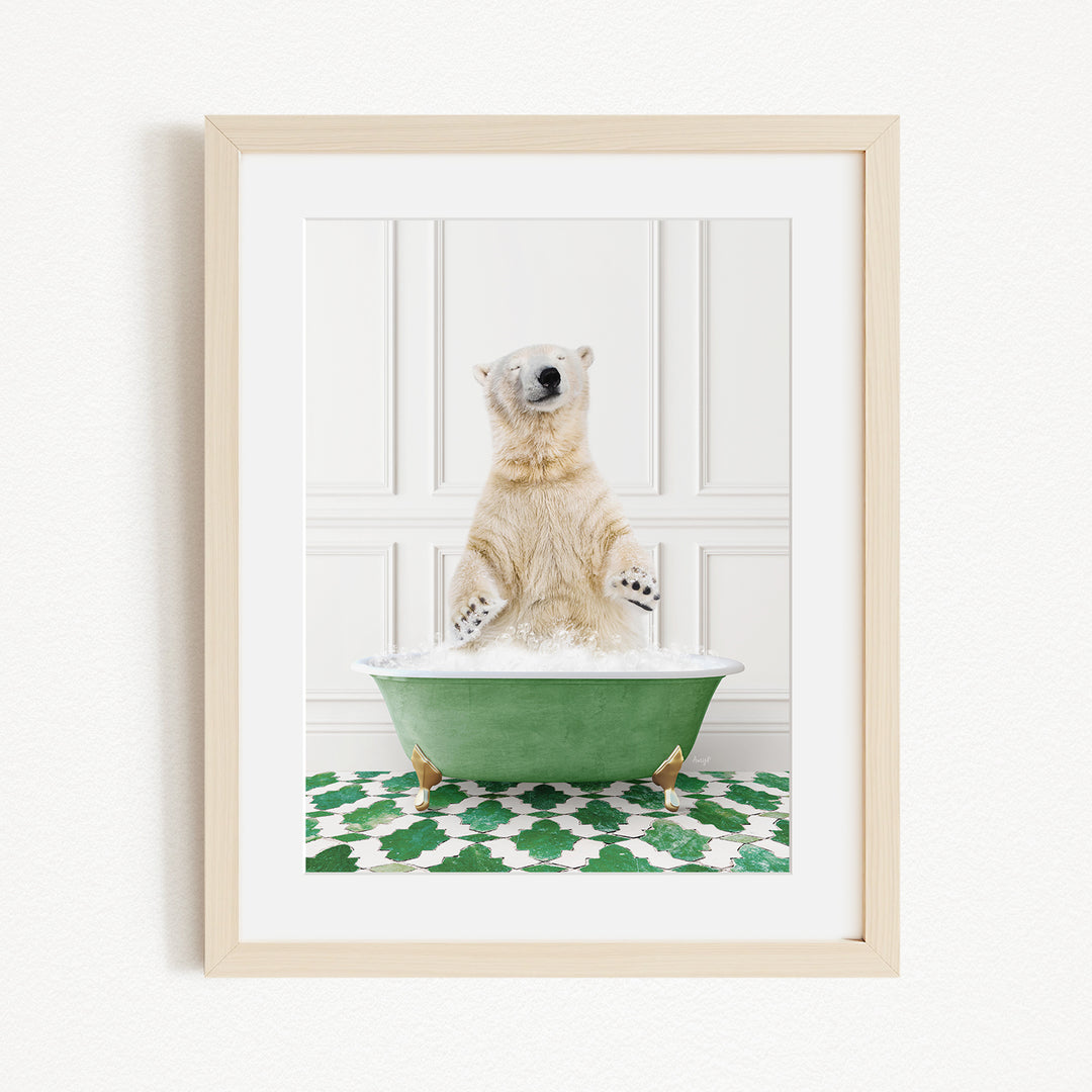 A polar bear standing in a green bathtub filled with bubbles, with its paws playfully raised in the air.