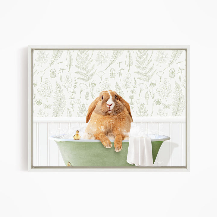 A brown rabbit sitting in a green bathtub filled with water, surrounded by a patterned wallpaper.