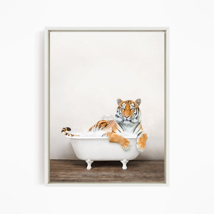 A tiger is sitting in a white bathtub, appearing relaxed and enjoying the bath.