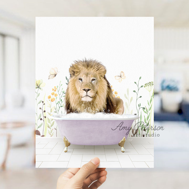 a hand holding a card with a picture of a lion in a bathtub