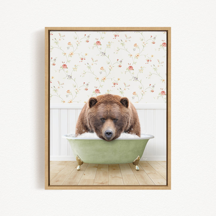 A brown bear is sitting in a green bathtub, appearing to be enjoying a bath.