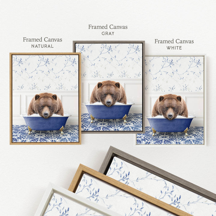 three framed pictures of a bear sitting in a blue bathtub, each with a different frame color: natural, gray, and white.