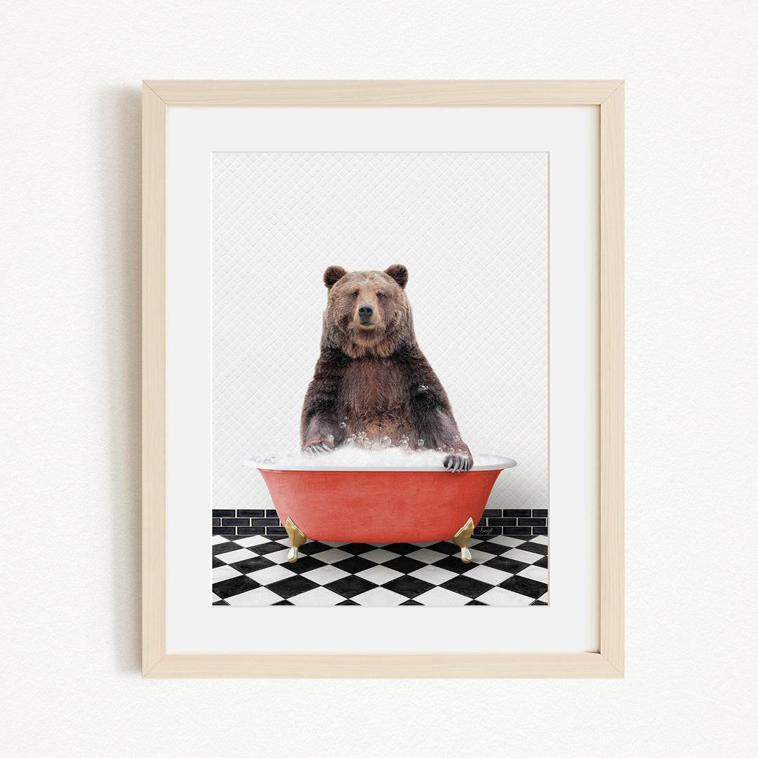 A brown bear sitting in a red bathtub filled with water, surrounded by a black and white checkered floor.