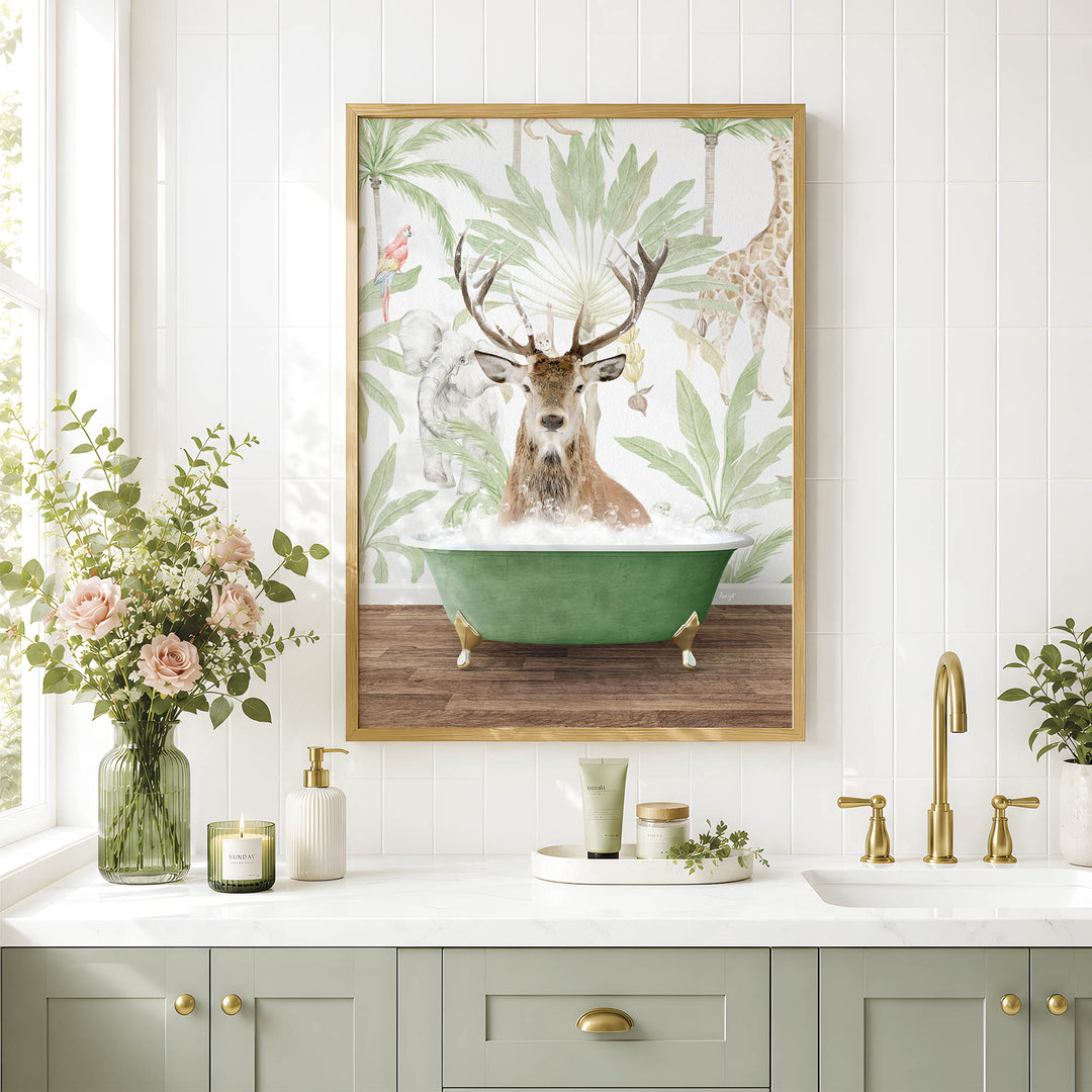 a bathroom with a framed picture of a deer in a bathtub, surrounded by tropical foliage. The bathroom has a white countertop, a green faucet, and a vase of flowers.