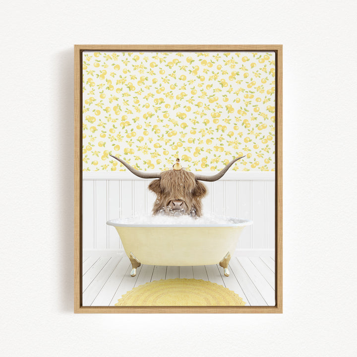 A brown cow with large horns is sitting in a white bathtub filled with bubbles, surrounded by a yellow floral wallpaper.