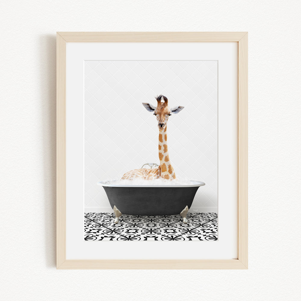 A giraffe is sitting in a bathtub filled with bubbles, creating a whimsical and playful scene.