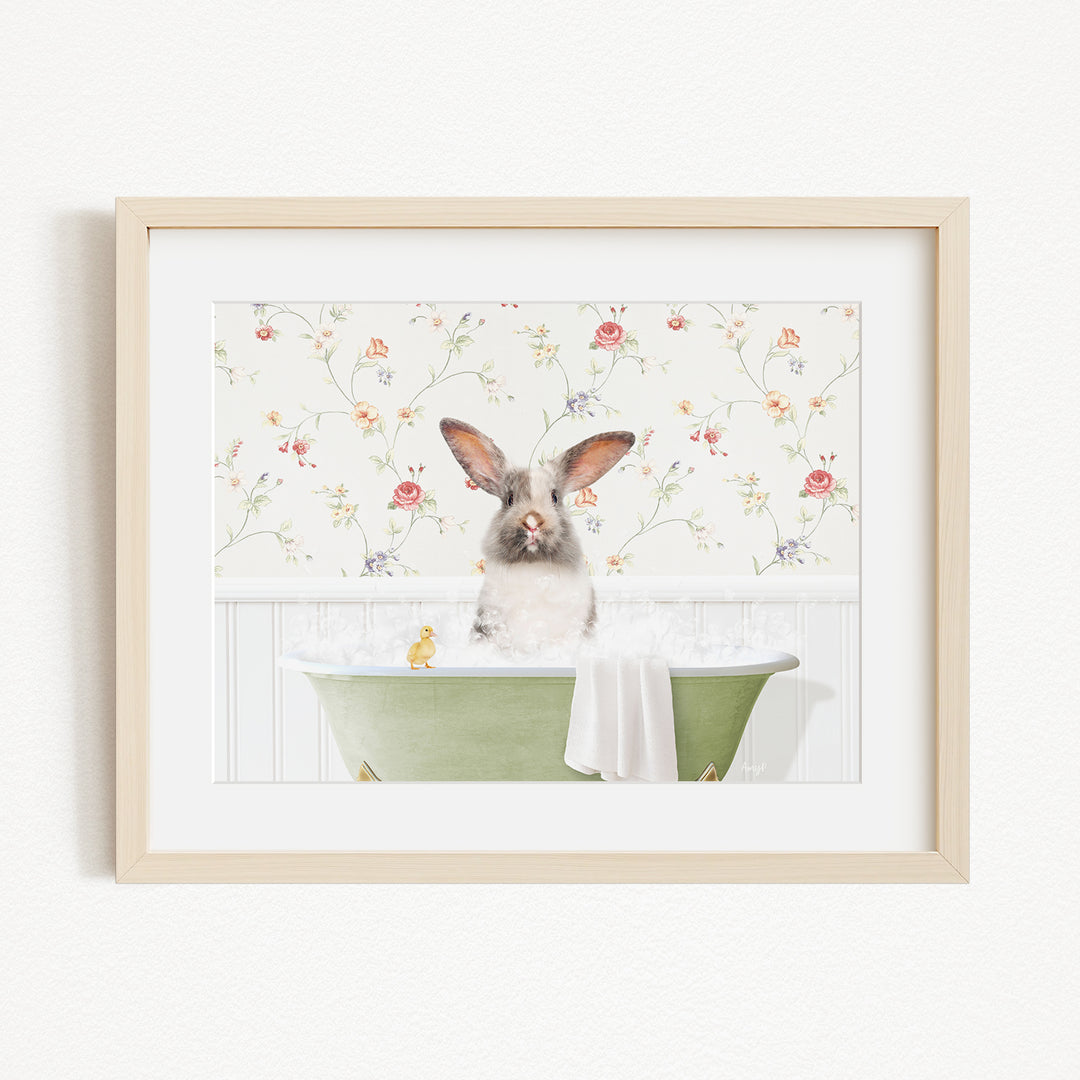 A fluffy white rabbit sits in a green bathtub filled with bubbles, surrounded by a floral wallpaper.