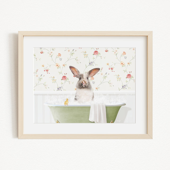 A fluffy white rabbit sits in a green bathtub filled with bubbles, surrounded by a floral wallpaper.