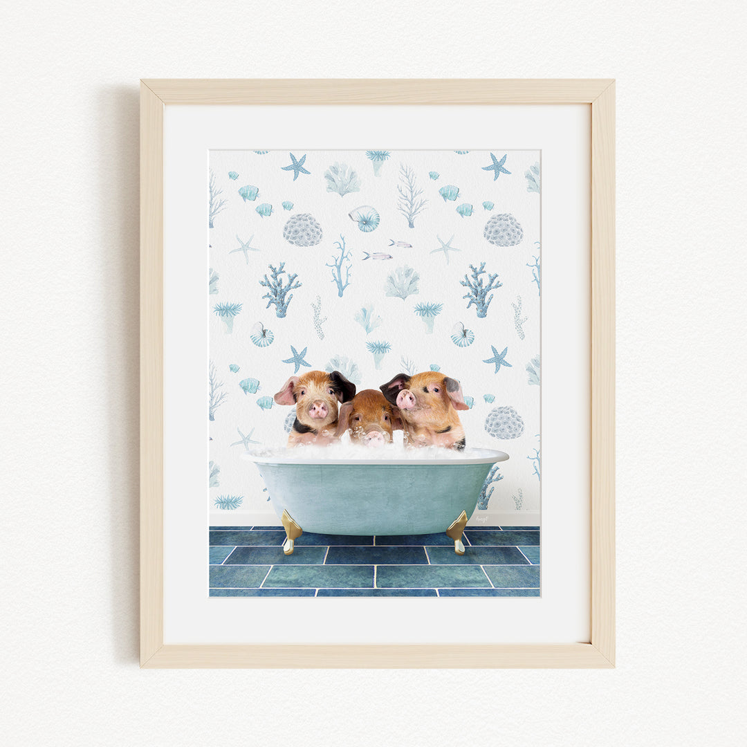 Three adorable pigs sitting in a bathtub, surrounded by a blue and white ocean-themed wallpaper.