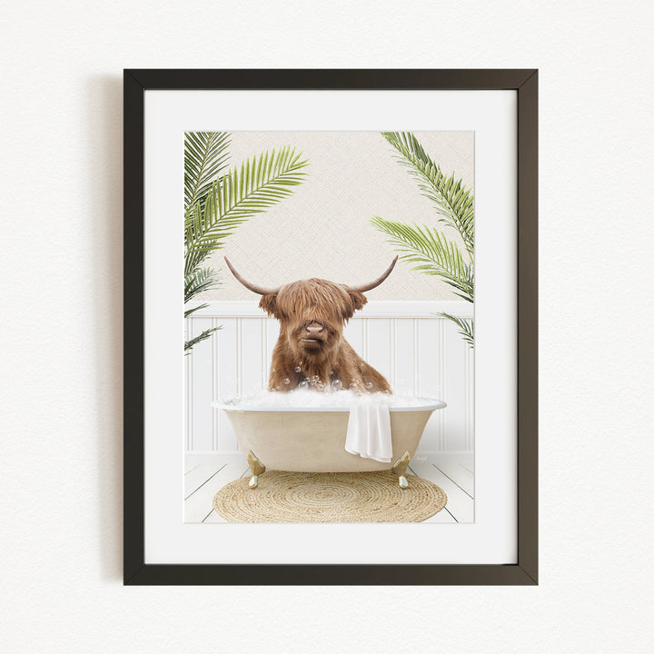 A brown cow with long horns is sitting in a bathtub filled with water, surrounded by green plants.