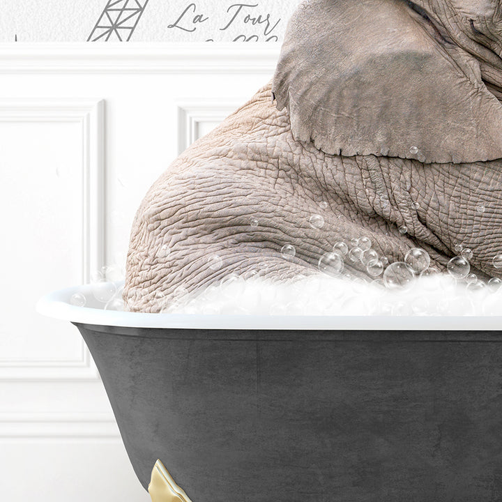 an elephant sitting in a bathtub with foam on it