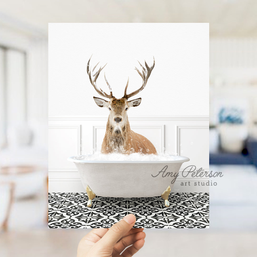 a hand holding up a card with a picture of a deer in a bathtub