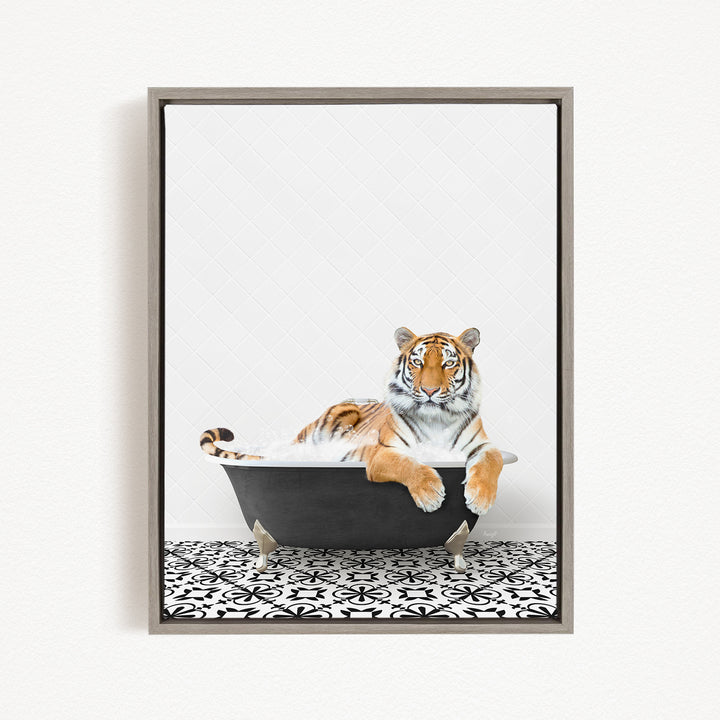 A tiger is sitting in a bathtub filled with water, surrounded by a black and white patterned floor.