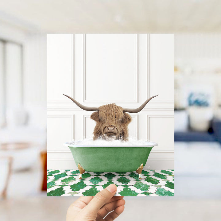 A Highland cow with large horns is sitting in a green bathtub filled with water, surrounded by a patterned green and white floor.