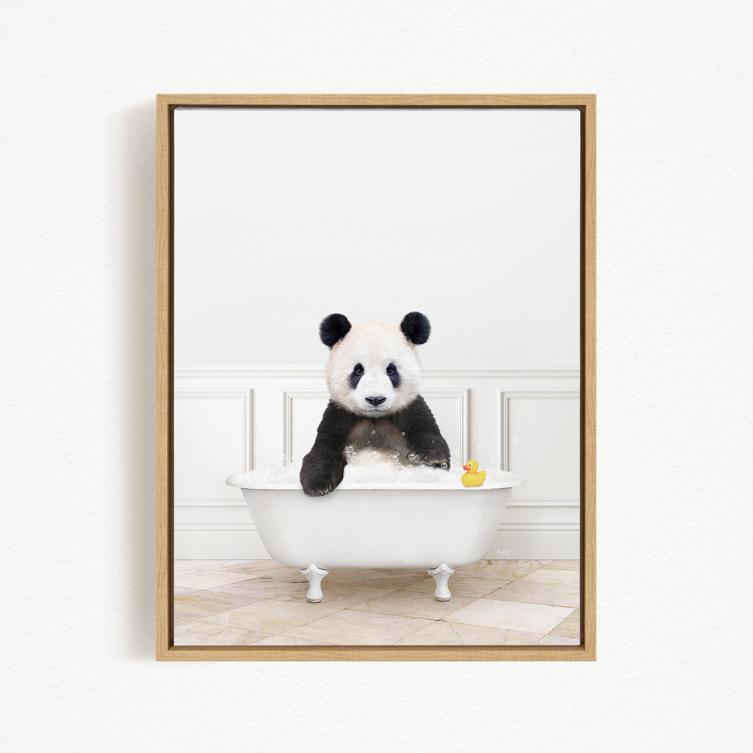 A panda bear sitting in a white bathtub, surrounded by a yellow rubber duck.
