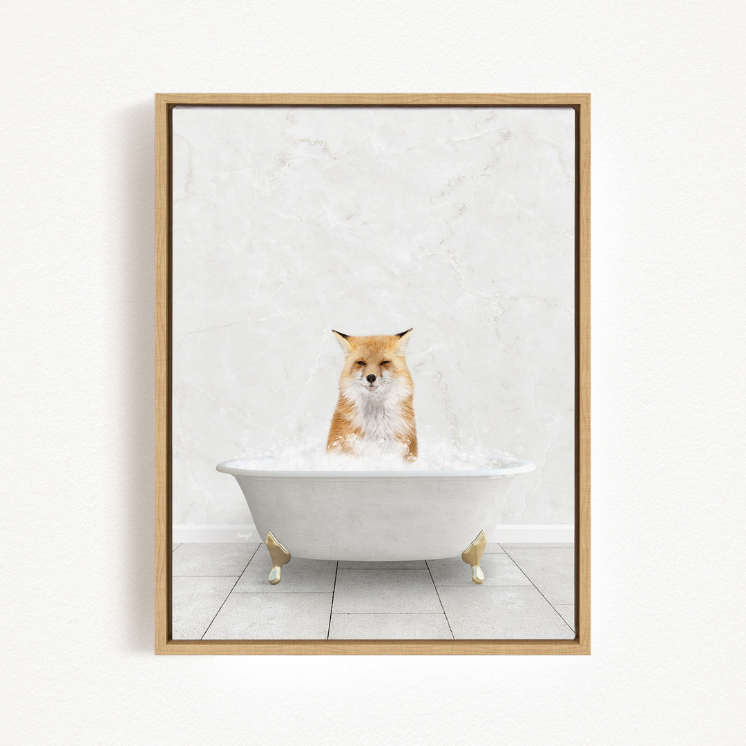 A red fox is sitting in a white bathtub filled with bubbles, looking directly at the camera.