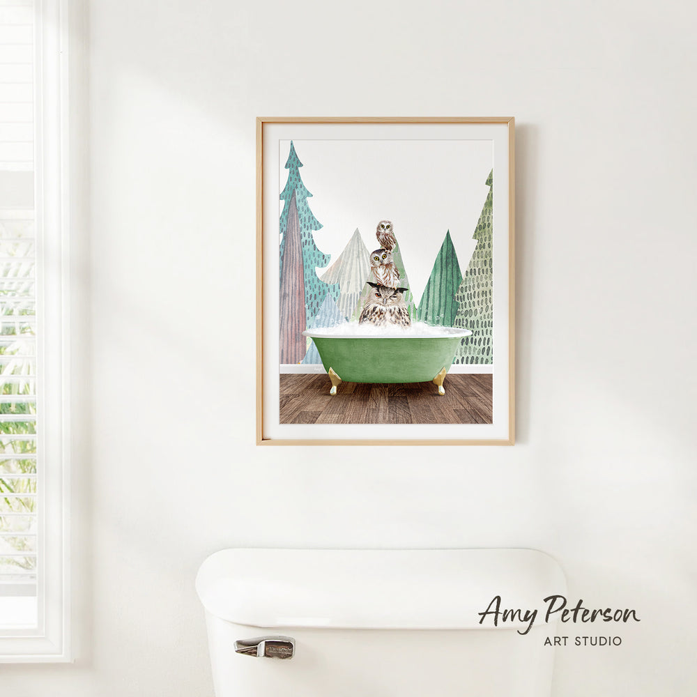A framed print of a whimsical scene depicting a person sitting in a bathtub surrounded by trees and a bird.