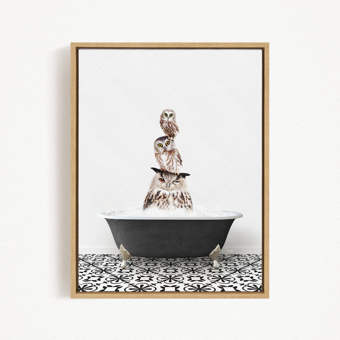 A framed image depicting three owls sitting in a bathtub filled with water, with a black and white patterned floor beneath them.