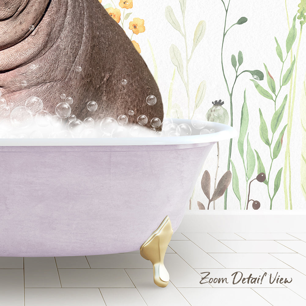 A large, pink bathtub filled with bubbles, with a gold claw-footed design, set against a wall with a floral pattern.