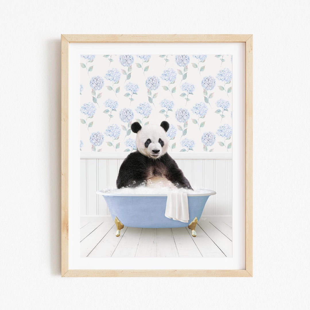 A panda bear sitting in a blue bathtub filled with bubbles, surrounded by a floral pattern on the wall behind it.