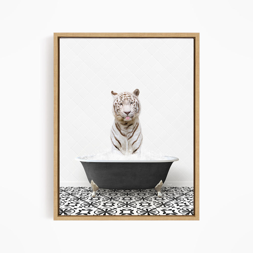 A white tiger sitting in a black bathtub filled with water, surrounded by a black and white patterned floor.