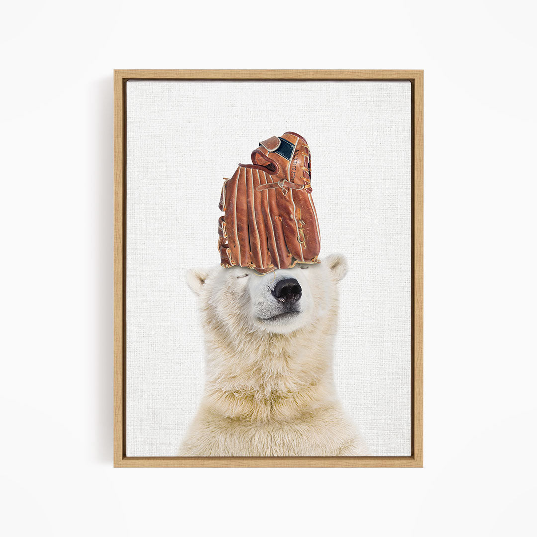 A polar bear wearing a baseball glove on its head, with the glove appearing to be made of leather.