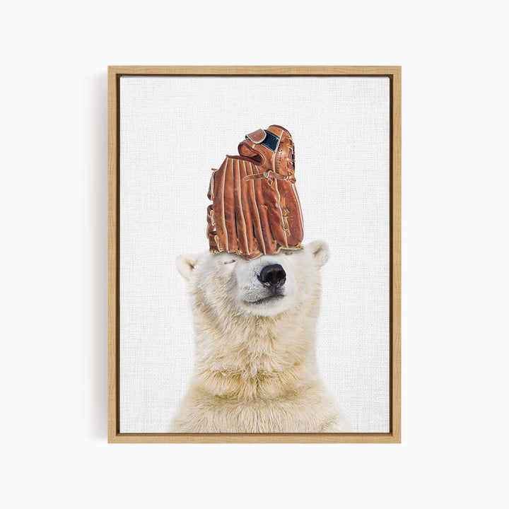 A polar bear wearing a baseball glove on its head, with the glove appearing to be made of leather.