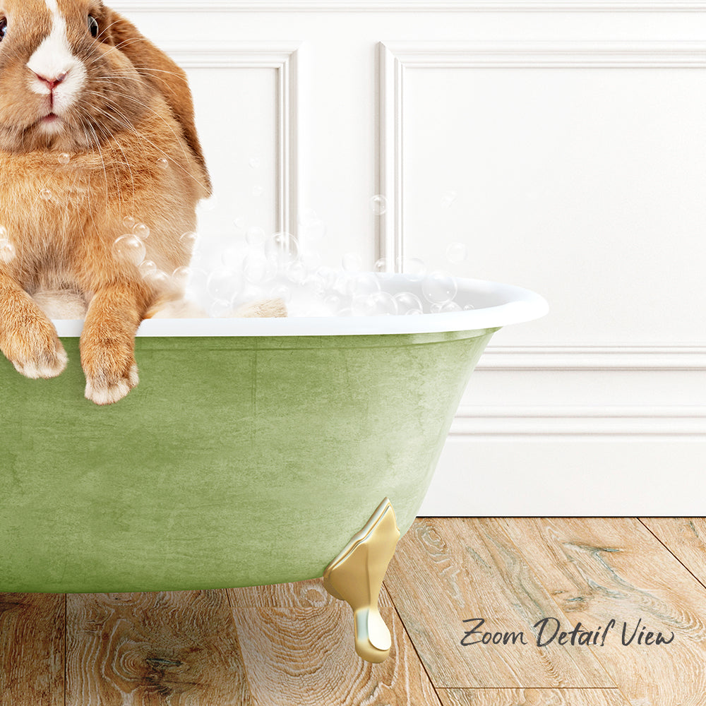 A brown rabbit sitting in a green bathtub filled with bubbles, with a wooden floor and white trim in the background.