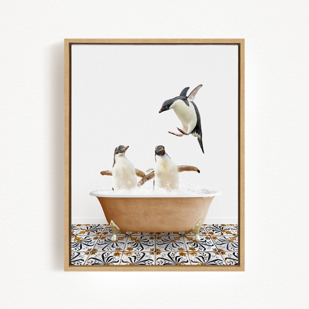 A framed image depicting two penguins sitting in a bathtub filled with bubbles, with one penguin flying towards the other.