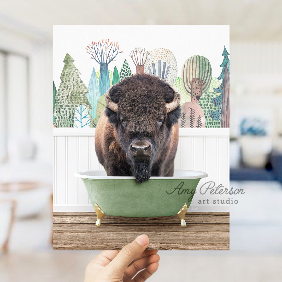 a hand holding up a card with a picture of a bison in a bowl