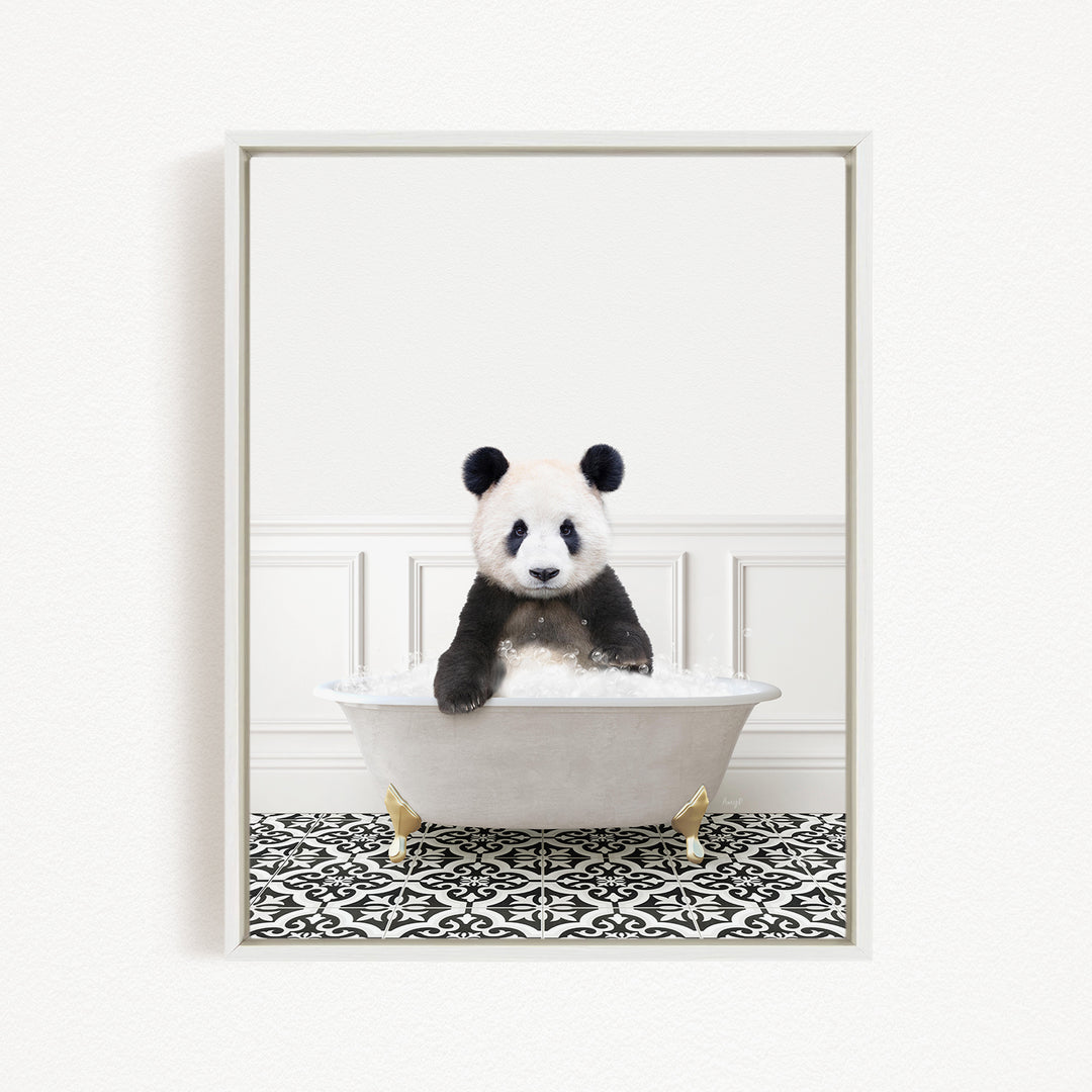 A panda bear sitting in a white bathtub filled with bubbles, surrounded by a black and white patterned floor.