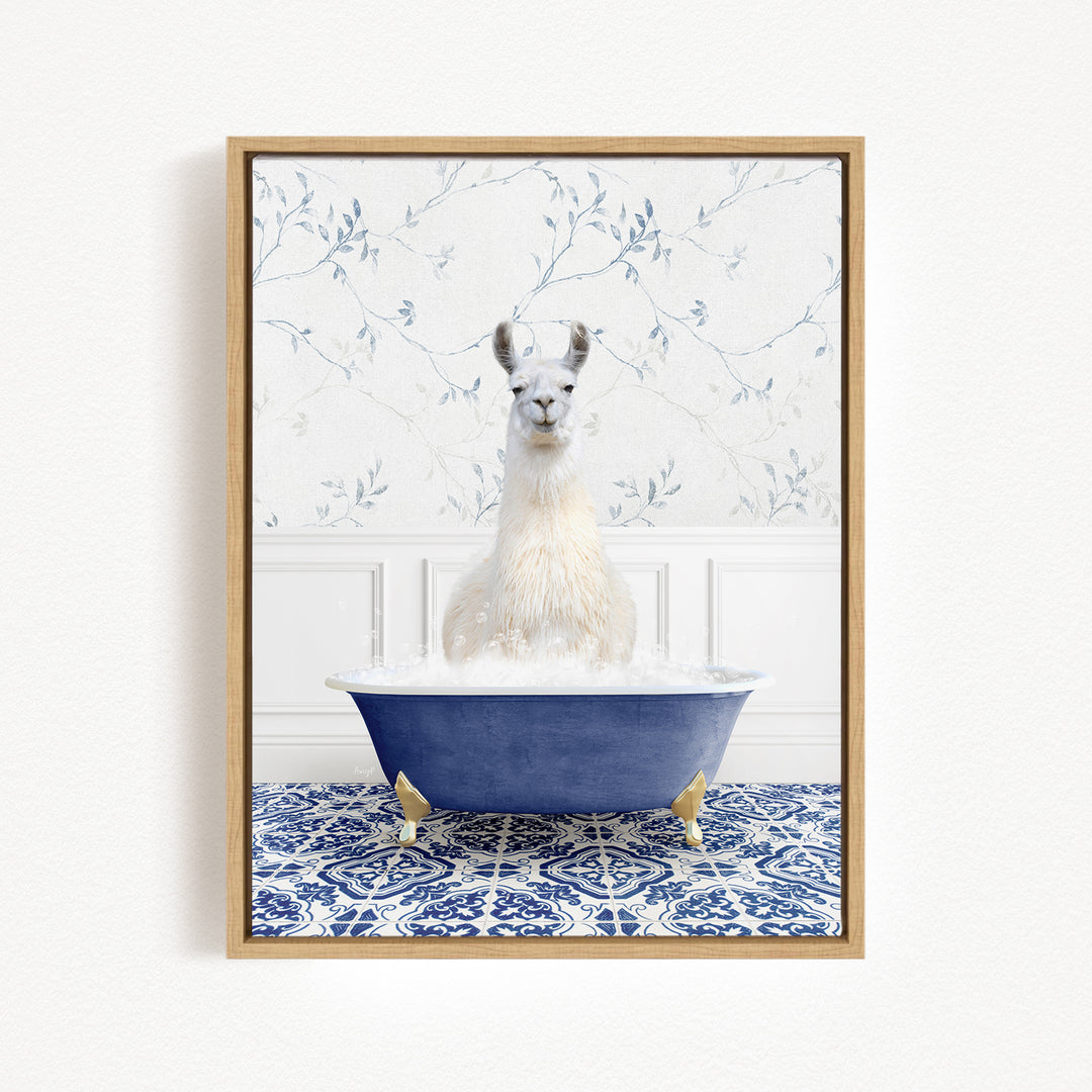 A white llama sitting in a blue bathtub filled with water, surrounded by a blue and white patterned tile floor.