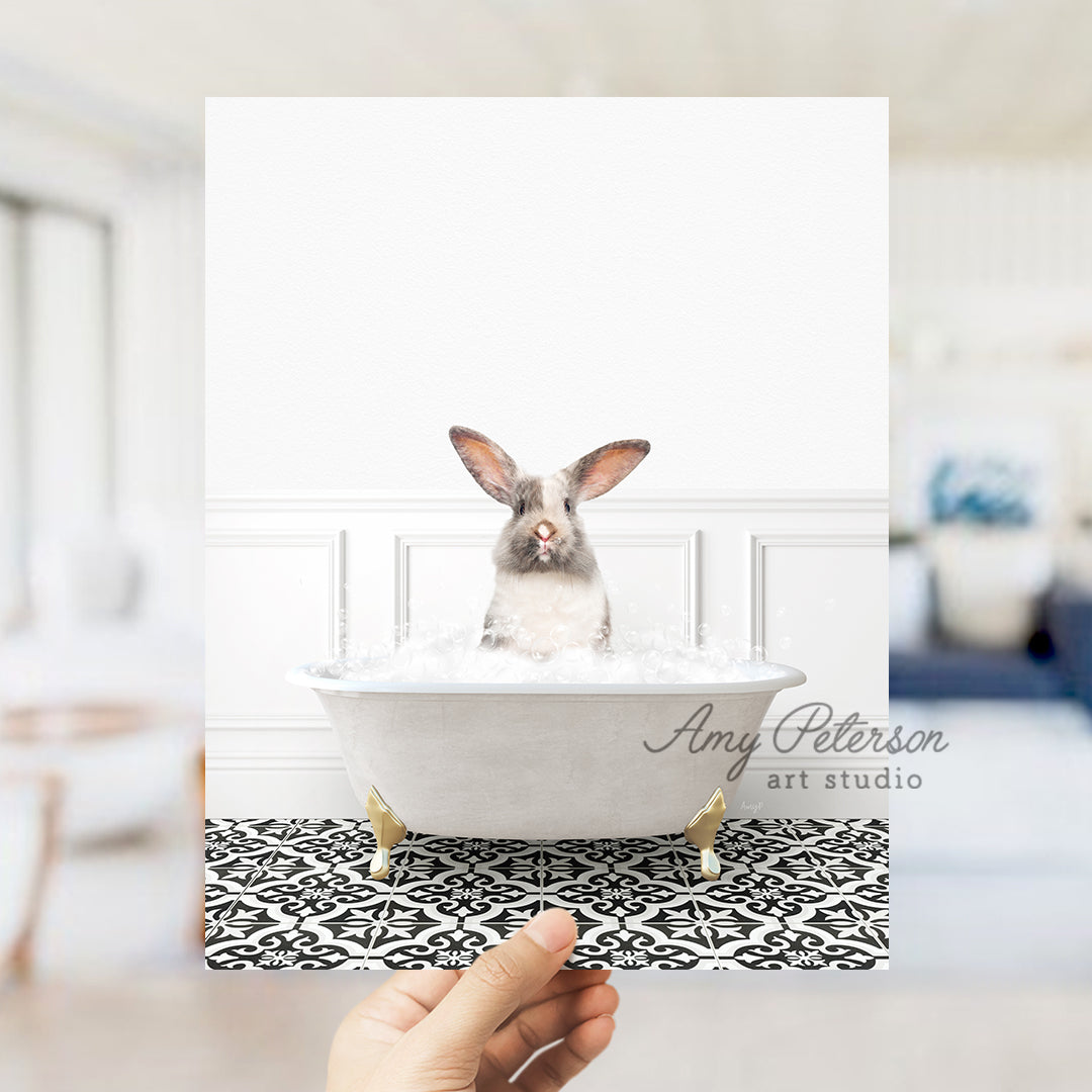 a person holding up a photo of a rabbit in a bathtub